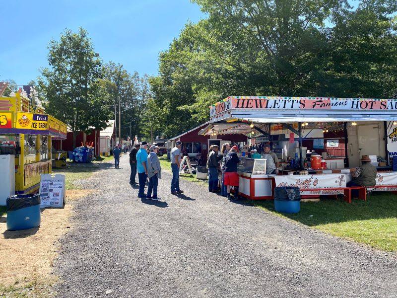 People place their orders at food stands