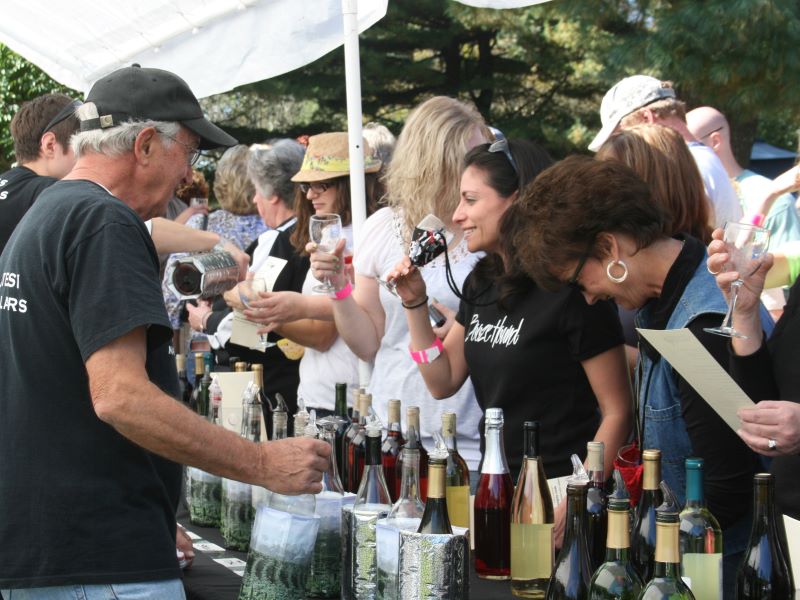 A winery pours tastings at a wine festival